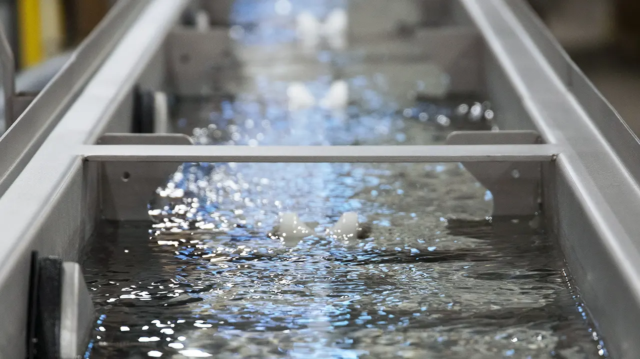 Water bath running newly extruded tubing